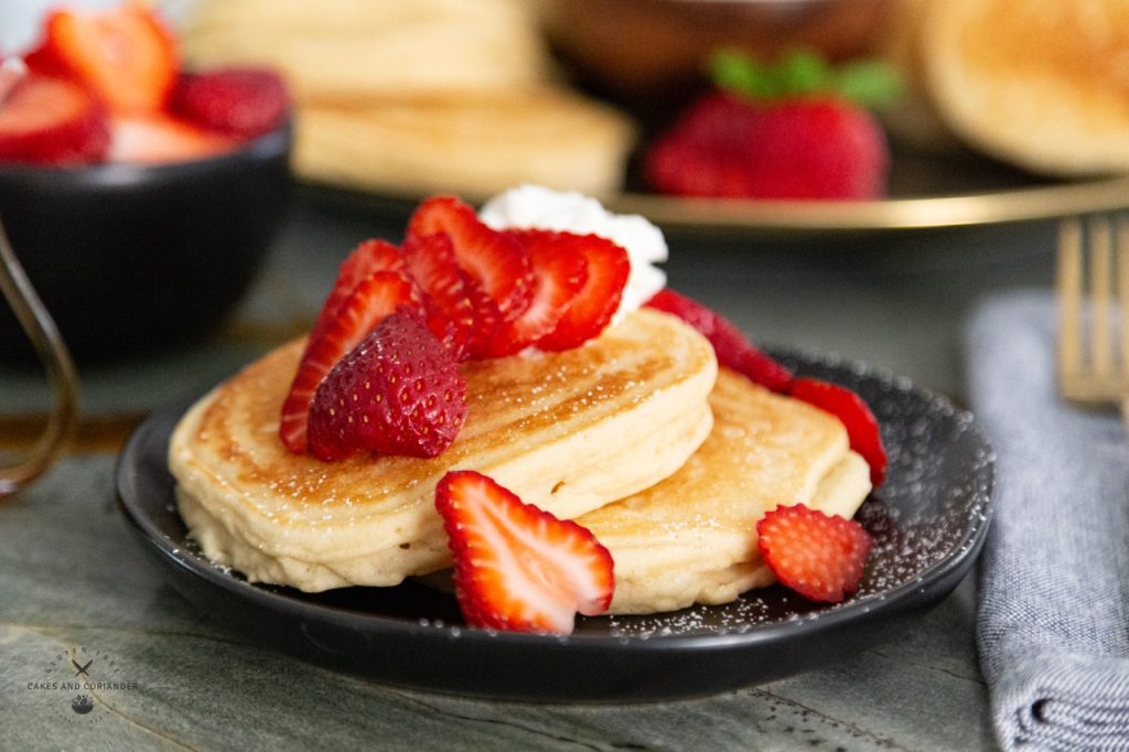 Wonderful Fluffy Buttermilk Gluten Free Pancakes with strawberries and whipped cream