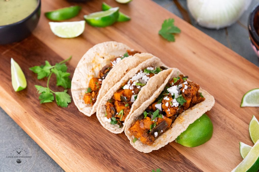 Gluten-free sweet potato tacos with vegan Soyrizo on corn tortillas. Vegetarian tacos enjoyed by everyone.