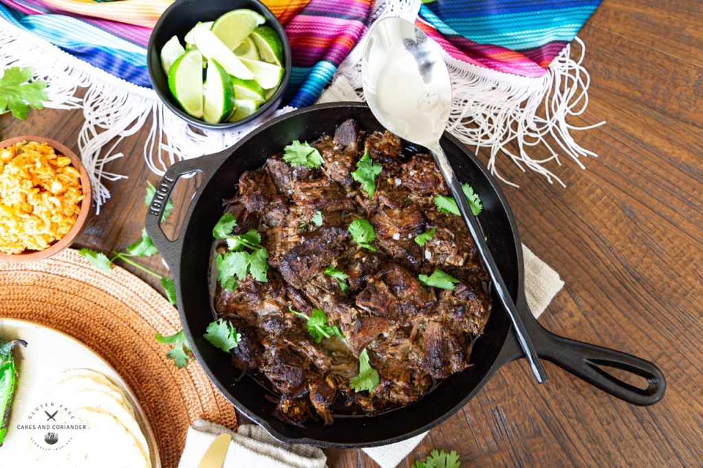 Mexican Shredded Beef Barbacoa in a cast iron pan