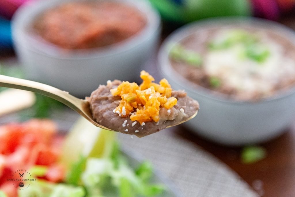 Spoon of homemade refried beans and rice