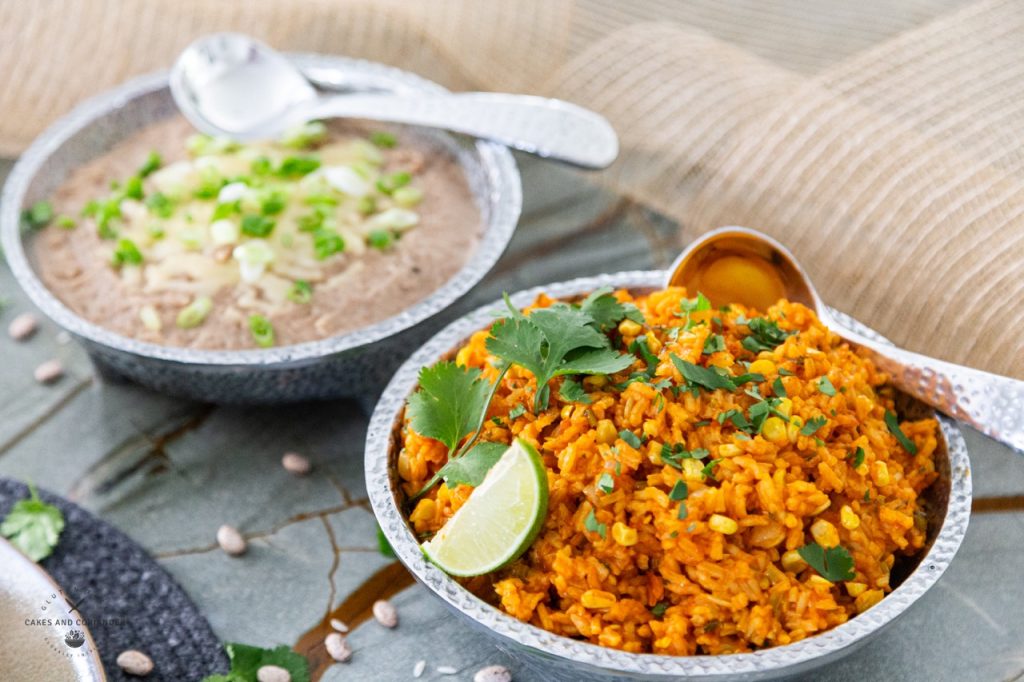 Mexican Rice and Refried Beans in bowls as a serving suggestion